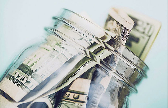 money photo of money in a jar
