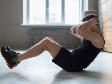 man doing situps on the floor
