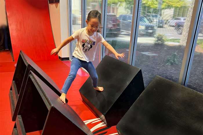quads-700x466 girl doing the quad steps in the ninja gym at the studio in roseville